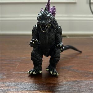 Black and Purple Action Figure of a Reptilian Creature